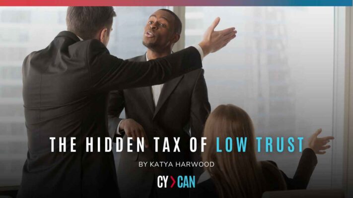 Business leaders in conflict during a meeting, representing the cost of low trust in organisations